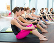 Aerobic Pilates personal trainer in a gym group class