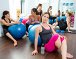 Aerobics pilates women group having a rest at gym