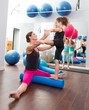 Aerobics woman personal trainer of children girl