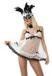 Pretty woman in white lingerie with black carnival mask