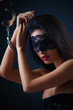 Dominating beauty in handcuffs