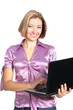 smiling young woman standing with laptop isolated on white backg