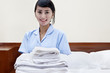 Hotel maid in a hotel room