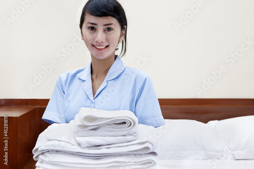 Photo: Hotel maid in a hotel room Hotel maid in a hotel room