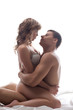 Couple playful lovers sit in bed - sexual games