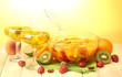 punch in bowl and glasses with fruits,