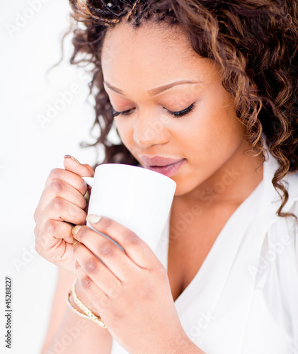 Photo: Woman drinking coffee Woman drinking coffee