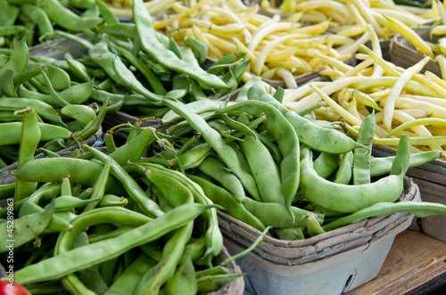 Photo: Multiple Green Pea Pods and Yellow Wax Beans in Baskets Multiple Green Pea Pods and Yellow Wax Beans in Baskets