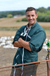 Duck breeder standing outside the farm