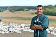 Duck breeder standing outside the farm