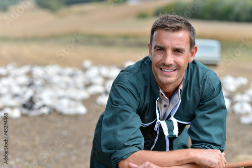 Photo: Duck breeder standing outside the farm Duck breeder standing outside the farm