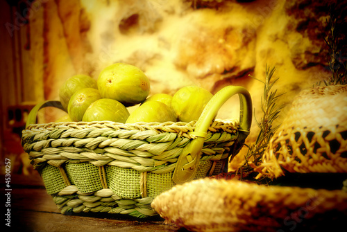Photo: basket of figs and straw hat basket of figs and straw hat