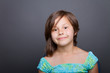 portrait of a caucasian girl against grey background