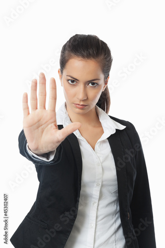 Photo: Asian Businesswoman with stop hand left Asian Businesswoman with stop hand left