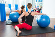stability ball in women Pilates class rear view
