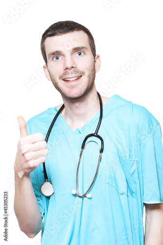 Photo: Male Surgeon Giving Thumbs Up For Good Health Male Surgeon Giving Thumbs Up For Good Health
