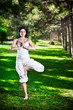 Photo: Yoga tree pose in park Yoga tree pose in park