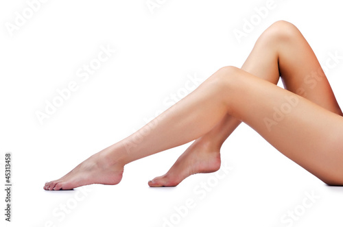 Photo: Long woman legs isolated on white Long woman legs isolated on white