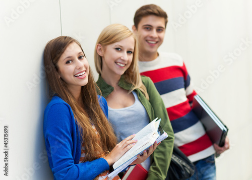 Photo: Students holding their books Students holding their books