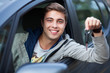 Man showing car key