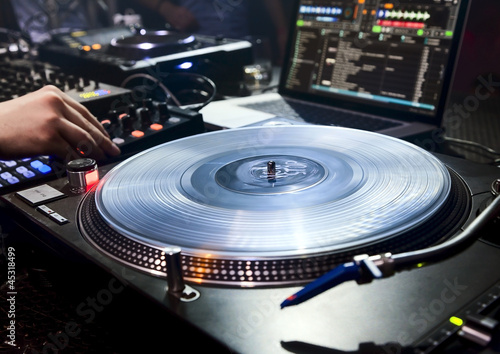 Photo: DJ plays set in vinyl player DJ plays set in vinyl player