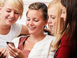 Foto: 4 girls with smartphone 4 girls with smartphone