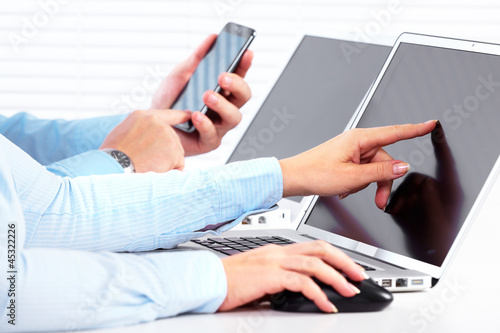 Photo: Business people calling by smartphone. Business people calling by smartphone.
