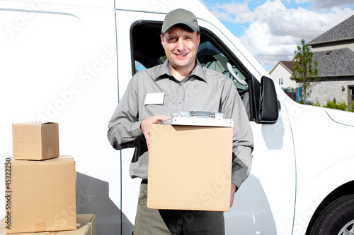 Photo: Delivery postal service man. Delivery postal service man.