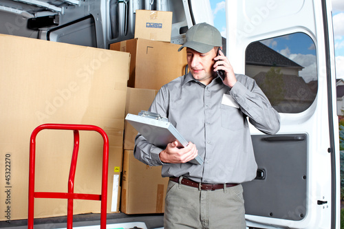 Photo: Delivery postal service man. Delivery postal service man.