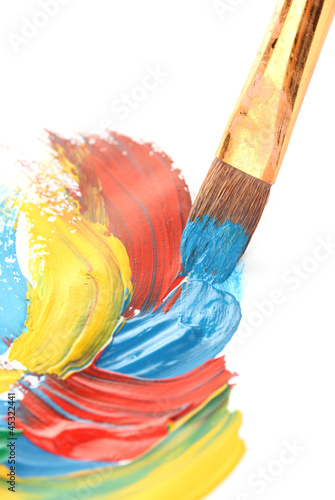 Photo: Abstract gouache paint and brush, isolated on white Abstract gouache paint and brush, isolated on white