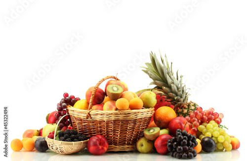 Photo: Assortment of exotic fruits and berries in baskets isolated Assortment of exotic fruits and berries in baskets isolated
