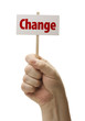 Hand Held Change Sign In Fist On White