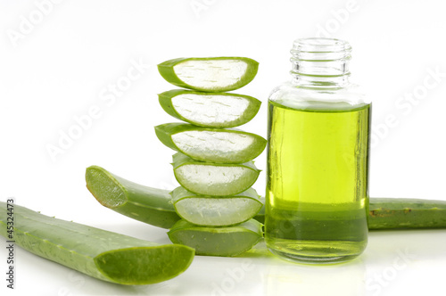 Photo: bottle of cosmetic with fresh aloe vera bottle of cosmetic with fresh aloe vera