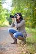 girl with photocamera at september