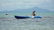 Woman kayaking at tropical sea