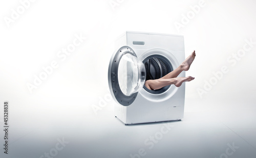 Photo: Conceptual photo of a woman absorbed by household duties Conceptual photo of a woman absorbed by household duties