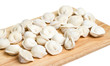 Some raw dumplings on the wooden board