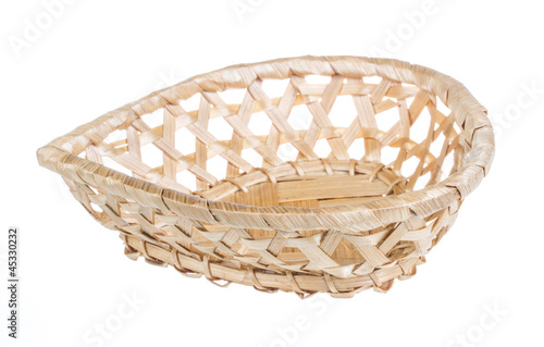 Photo: Wickerwork empty yellow breadbasket on white background Wickerwork empty yellow breadbasket on white background