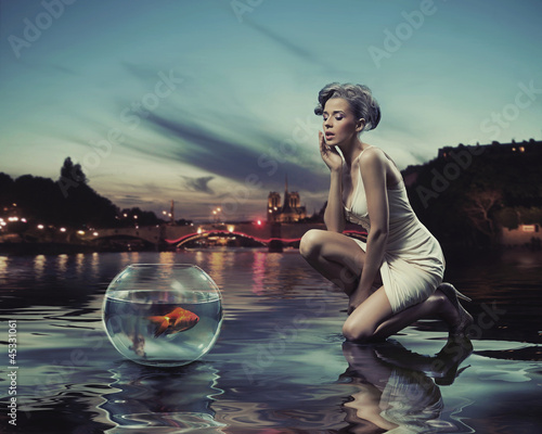 Photo: Beauty lady with gold fish Beauty lady with gold fish