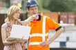 Photo: Businesswoman and worker with laptop Businesswoman and worker with laptop