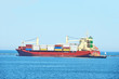 Tugboat assisting cargo ship over lighthouse in Odessa, Ukraine
