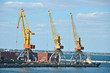 Tugboat and freight train under port crane, Odessa, Ukraine