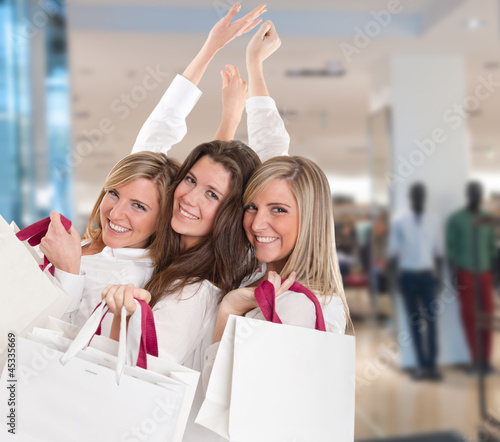 Photo: Three happy shoppers Three happy shoppers