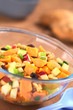Salad made of sweet potato, apple, nut, raisin, shallot