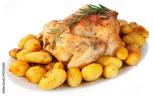 Photo: Delicious roast chicken with potatoes on white background Delicious roast chicken with potatoes on white background