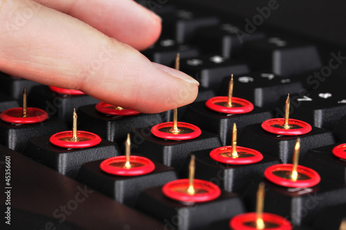 Photo: Painful typing on keyboard close-up Painful typing on keyboard close-up
