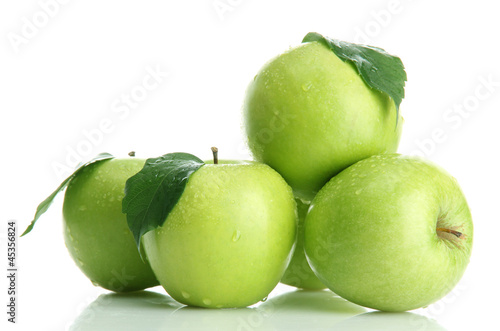 Photo: Ripe green apples with leaves isolated on white Ripe green apples with leaves isolated on white