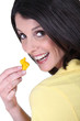 Woman with a tiny yellow toy duck