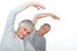 Photo: Elderly couple warming up Elderly couple warming up