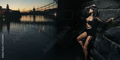 Photo: Sexy woman standing next to the bridge Sexy woman standing next to the bridge